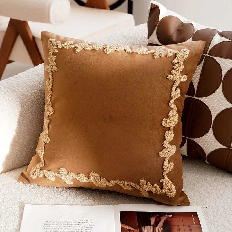 Brown pillow with decorative trim on a couch